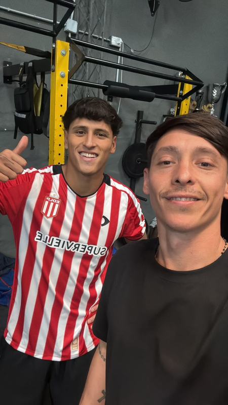 Deportista de Peak Performance junto a un entrenador